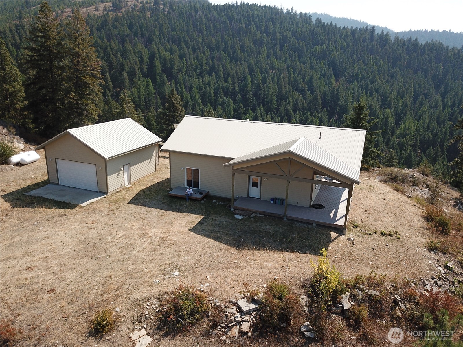 167 Excelsior Way Curlew, WA 99118 - Photo 19 of 37 a view of a house with a yard and large tree
