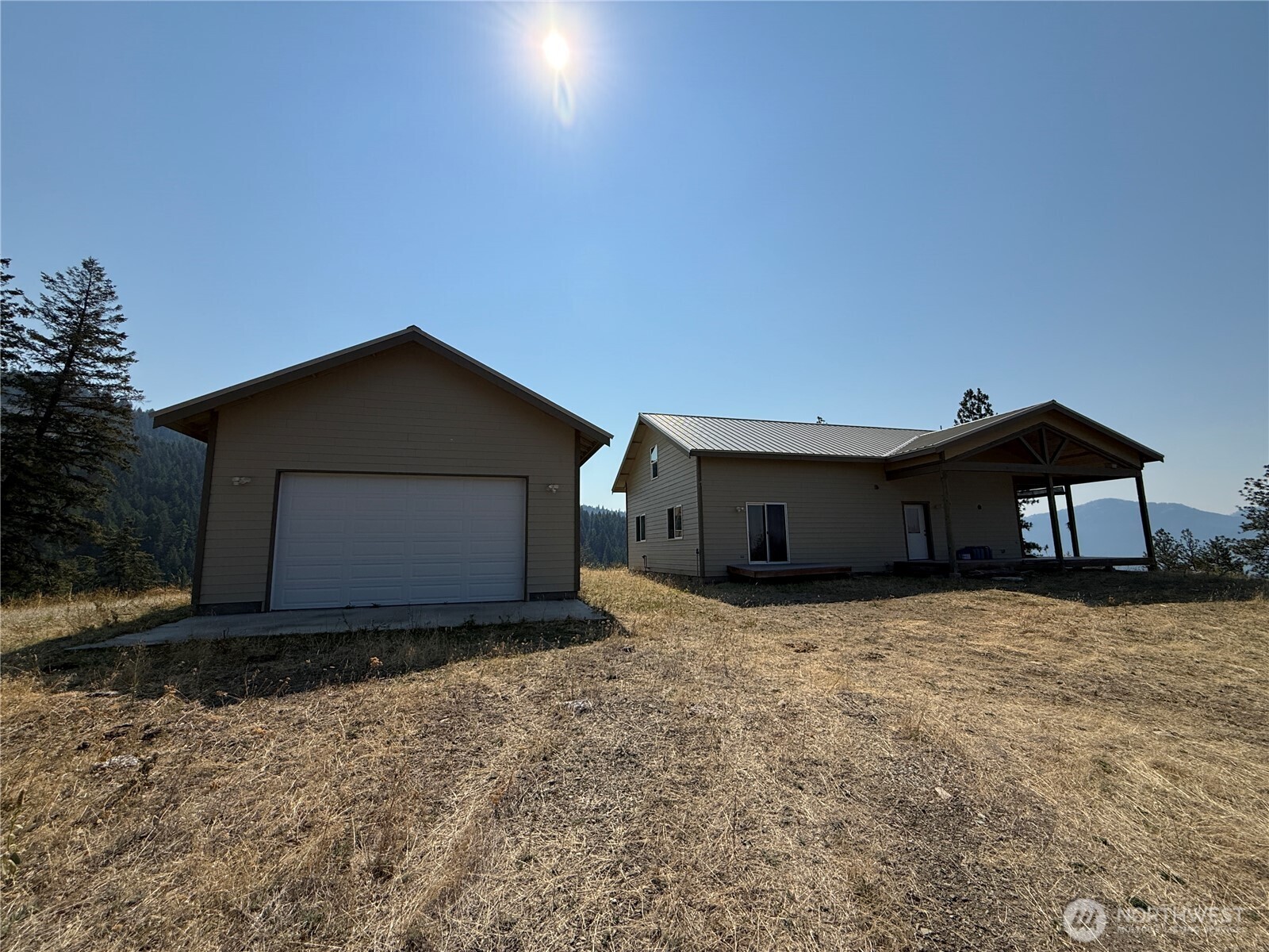 167 Excelsior Way Curlew, WA 99118 - Photo 20 of 37 a house with yard in front of it