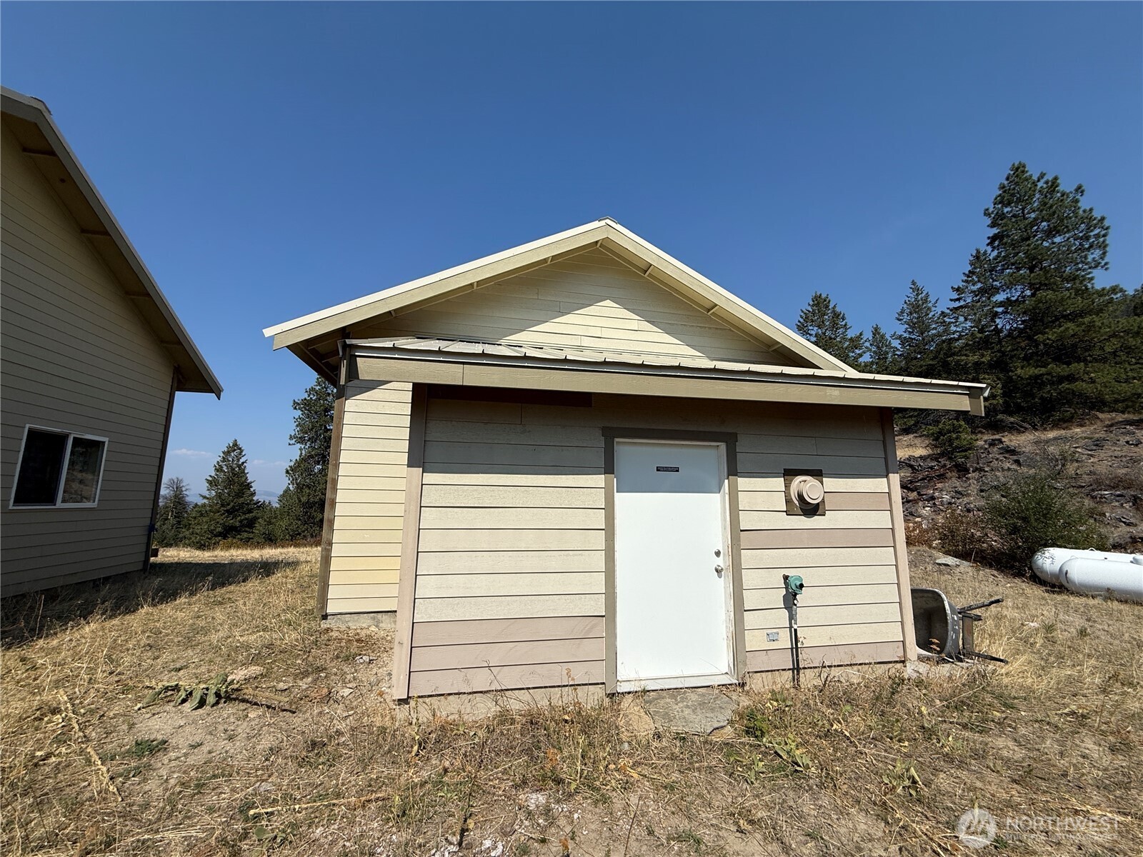 167 Excelsior Way Curlew, WA 99118 - Photo 21 of 37 a front view of a house with a yard