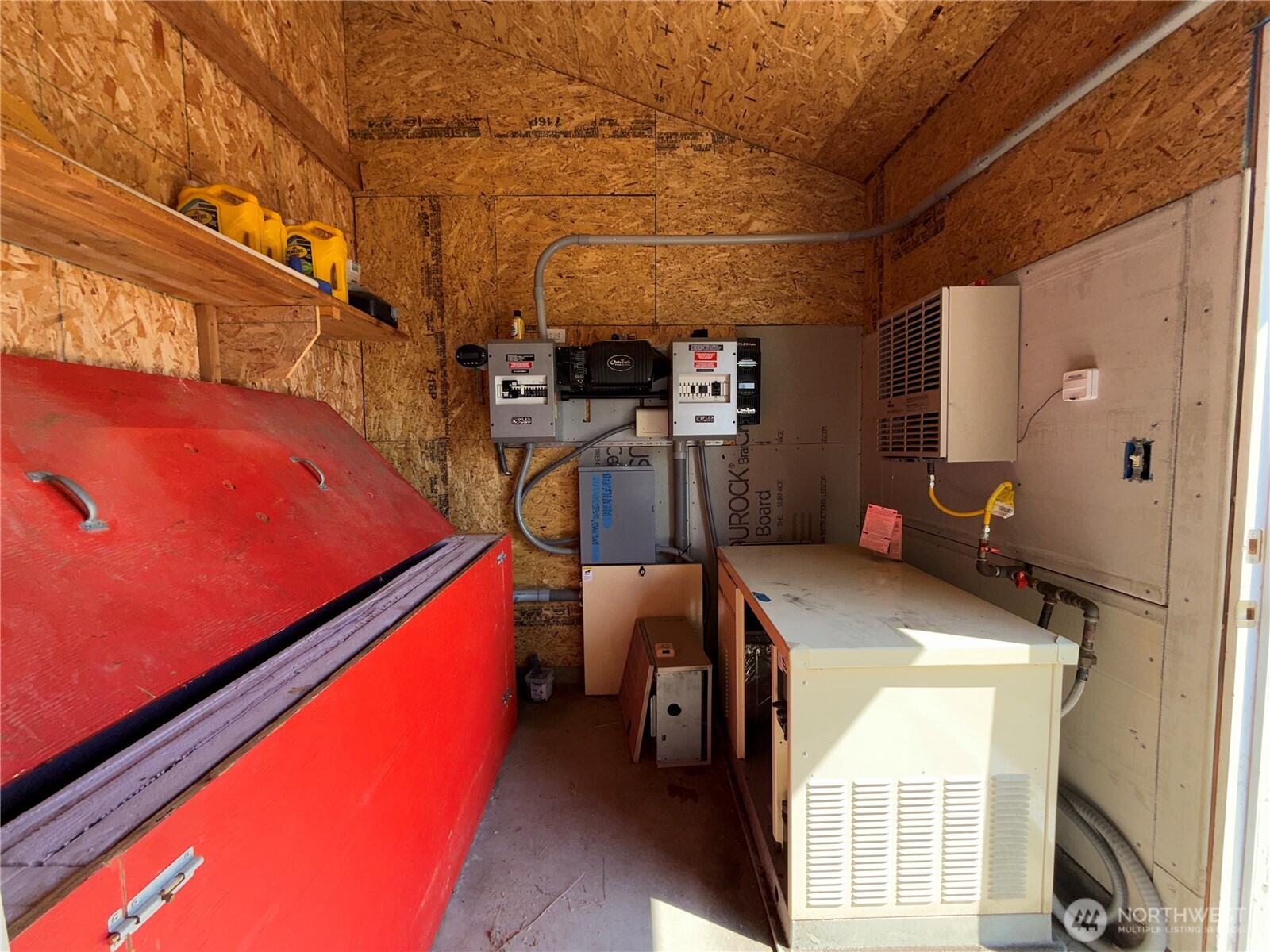 167 Excelsior Way Curlew, WA 99118 - Photo 22 of 37 a room with water heater and wooden floor