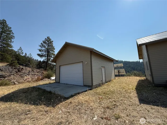 a backyard of a house with wooden fence