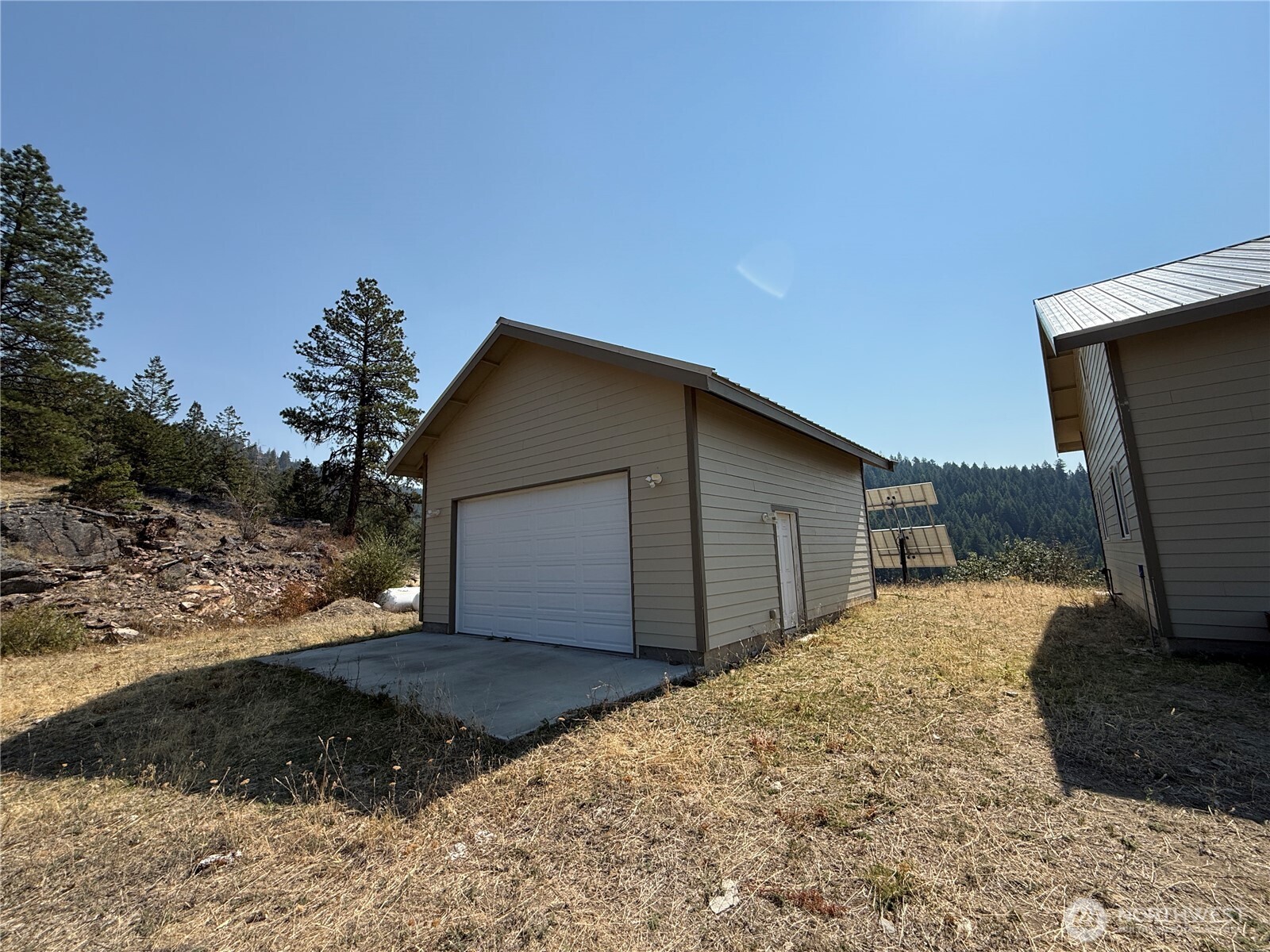 167 Excelsior Way Curlew, WA 99118 - Photo 3 of 37 a backyard of a house with wooden fence