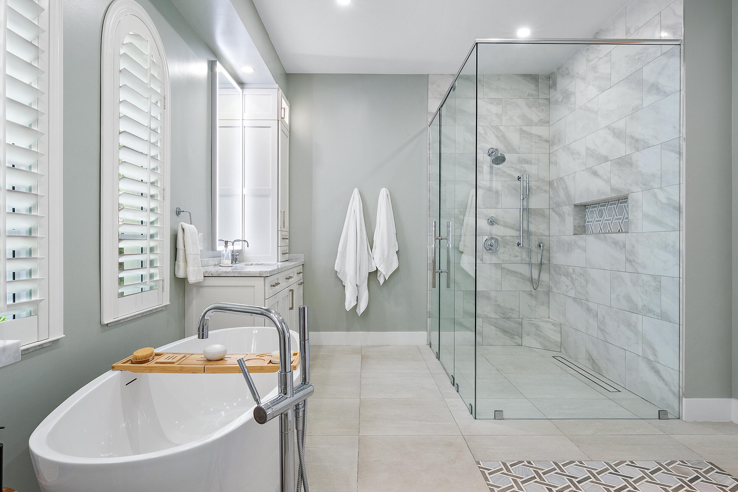 105 Segovia Way Jupiter, FL 33458 - Photo 16 of 33 a bathroom with a sink and a shower