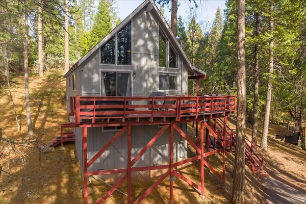 a view of house with outdoor seating