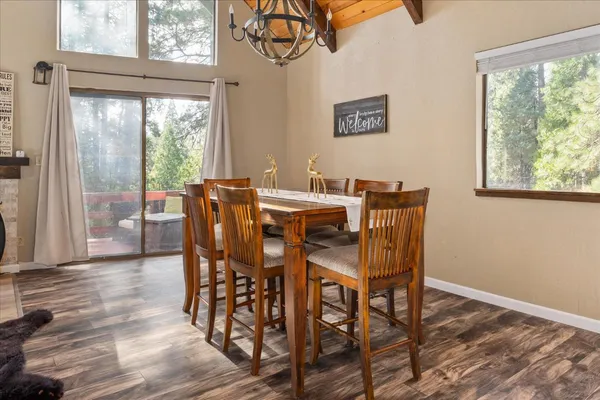 a view of a dining room with furniture window and wooden floor