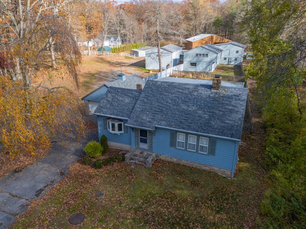 219-221 Peeptoad Road Scituate, RI 02857 - Photo 1 of 16 a aerial view of a house with a yard