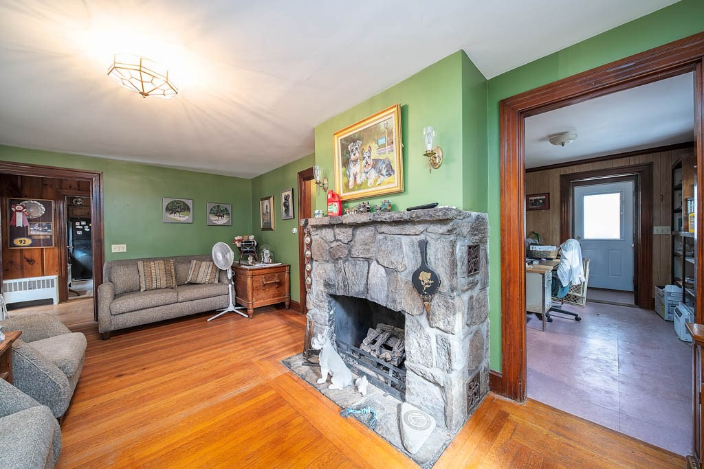 219-221 Peeptoad Road Scituate, RI 02857 - Photo 4 of 16 a living room with furniture and a fireplace