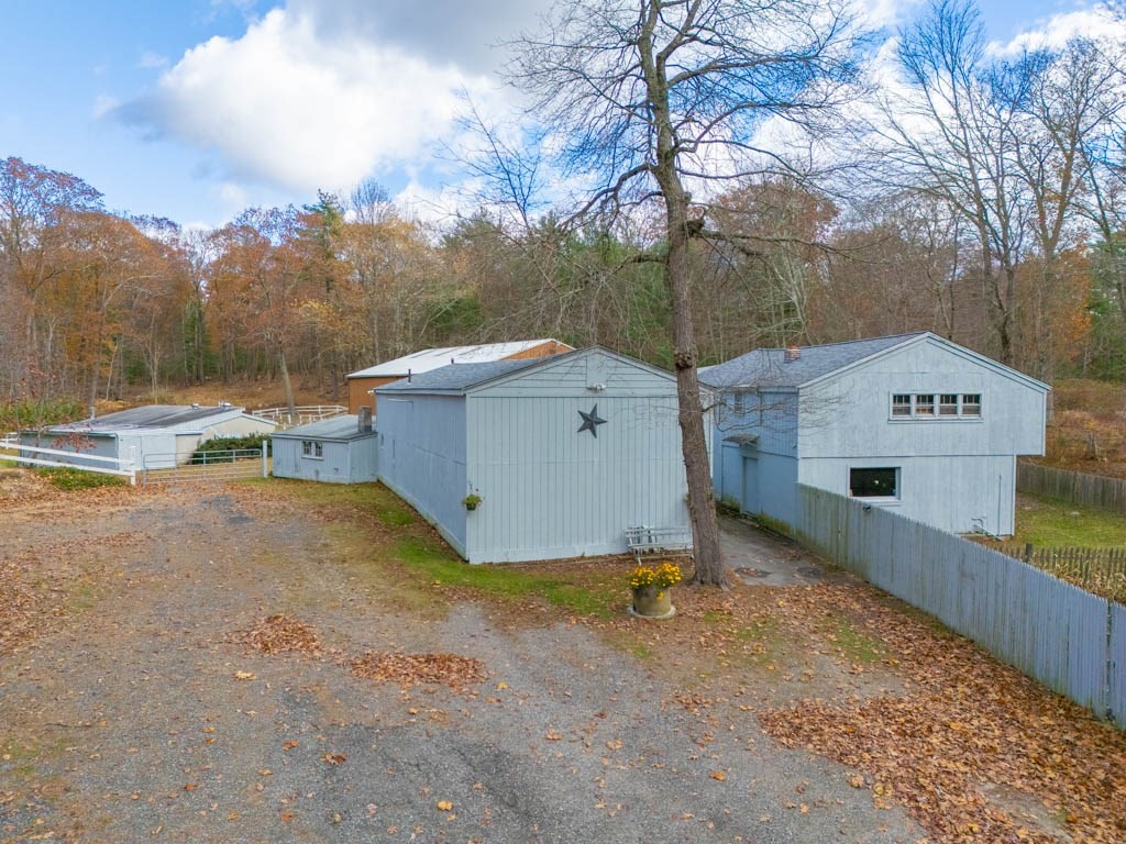 219-221 Peeptoad Road Scituate, RI 02857 - Photo 9 of 16 a view of a house with a yard