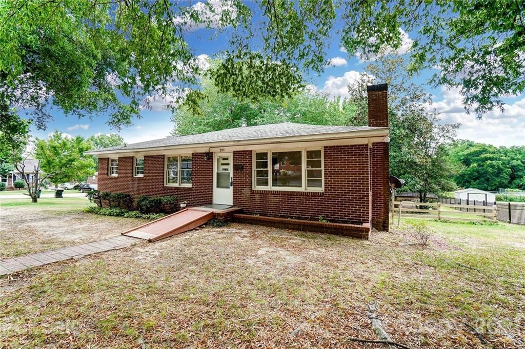 201 Lydia Street Monroe, NC 28110 - Photo 2 of 39 a view of a house with a yard