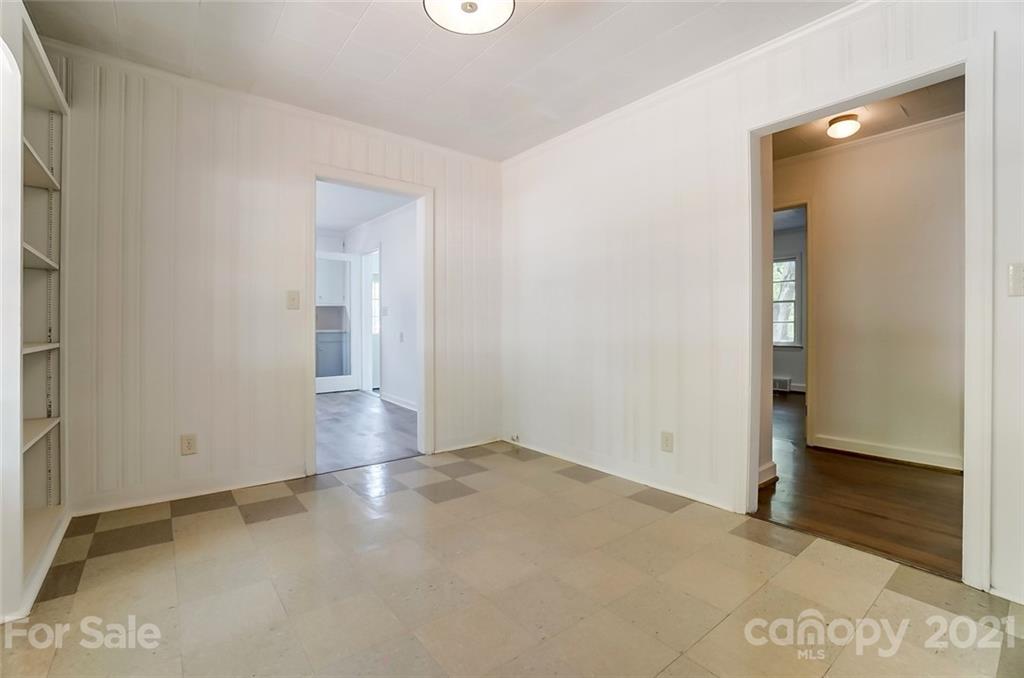 201 Lydia Street Monroe, NC 28110 - Photo 13 of 39 an empty room with wooden floor and windows