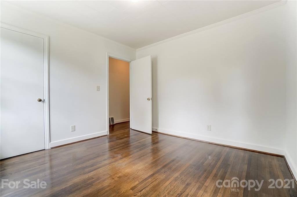 201 Lydia Street Monroe, NC 28110 - Photo 27 of 39 an empty room with wooden floor