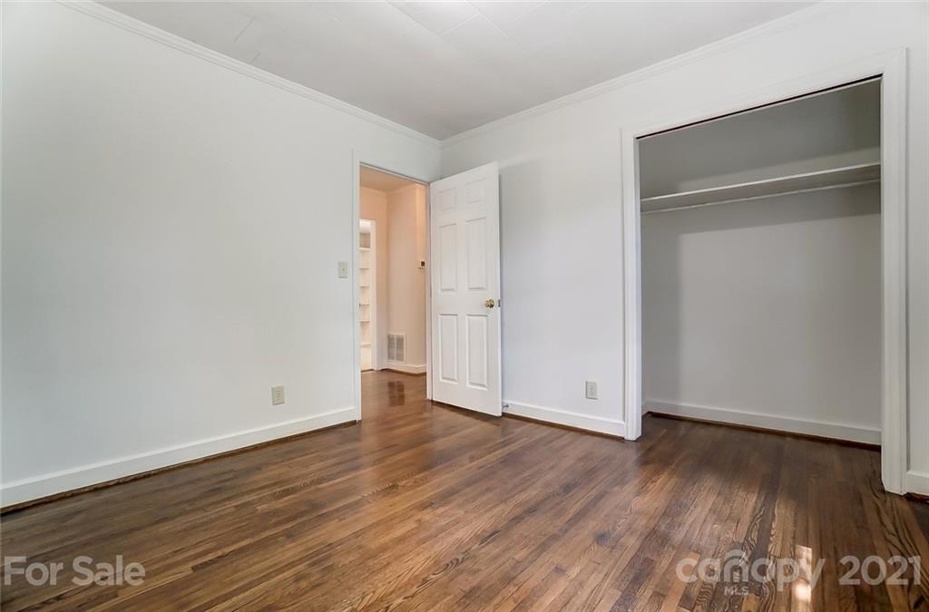 201 Lydia Street Monroe, NC 28110 - Photo 32 of 39 a view of an empty room with wooden floor