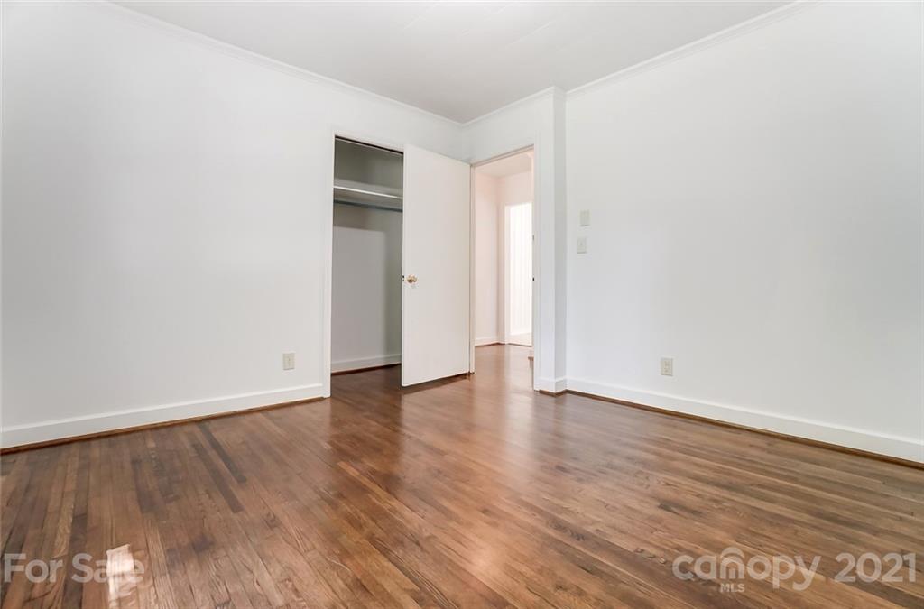 201 Lydia Street Monroe, NC 28110 - Photo 33 of 39 a view of an empty room with wooden floor and closet