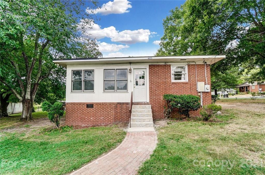 201 Lydia Street Monroe, NC 28110 - Photo 36 of 39 a front view of a house with garden