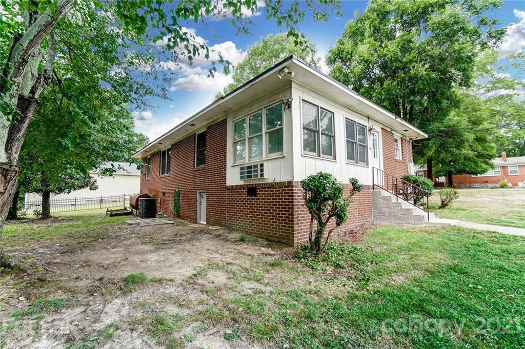 201 Lydia Street Monroe, NC 28110 - Photo 37 of 39 a house view with a garden space