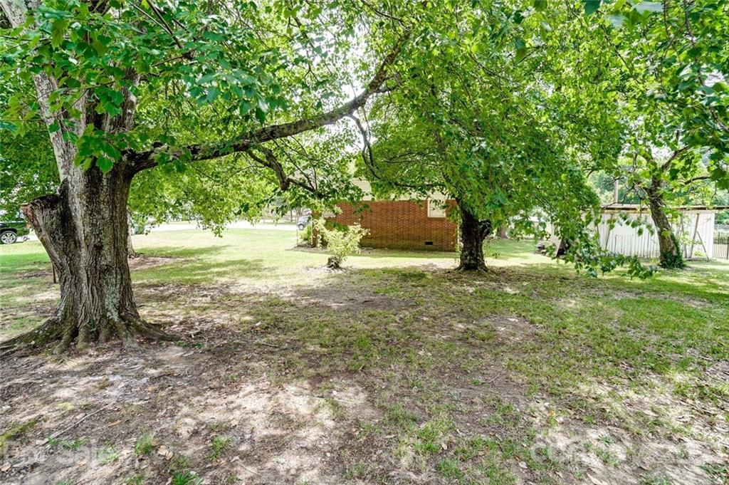201 Lydia Street Monroe, NC 28110 - Photo 39 of 39 a view of a yard with large trees