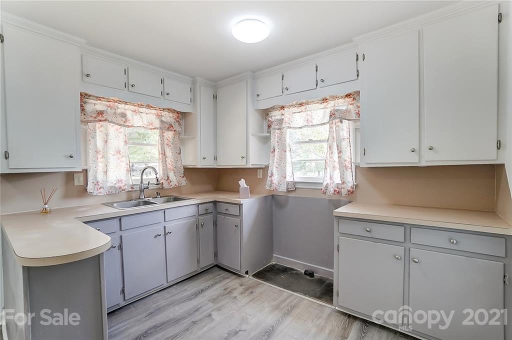 201 Lydia Street Monroe, NC 28110 - Photo 5 of 39 a kitchen with sink cabinets and window