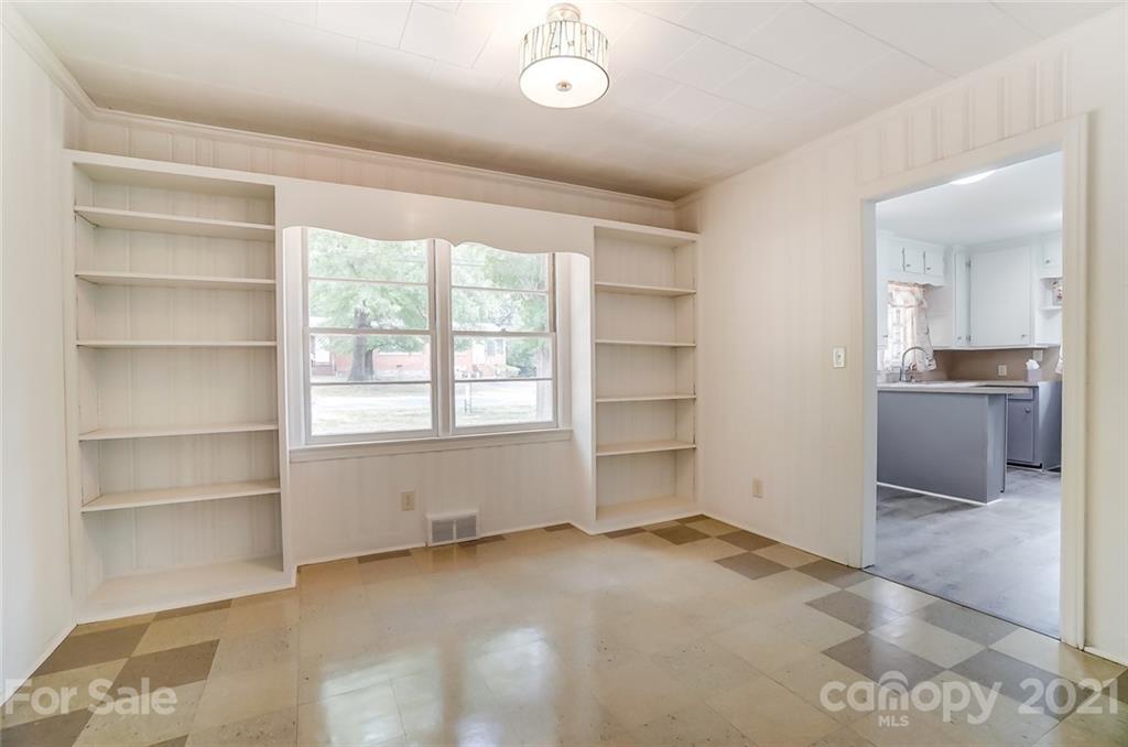 201 Lydia Street Monroe, NC 28110 - Photo 10 of 39 a view of an empty room with a window
