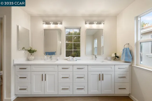 a bedroom with a bed and a mirror