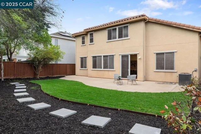 a front view of a house with a yard and porch
