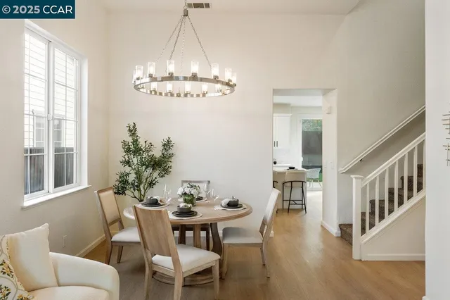 a view of a dining room with furniture window and wooden floor