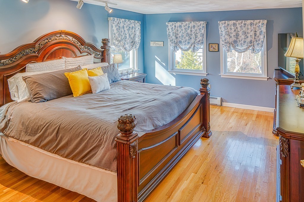 66 Mountwood Road Swampscott, MA 01907 - Photo 16 of 29 a bedroom with a bed and wooden floor