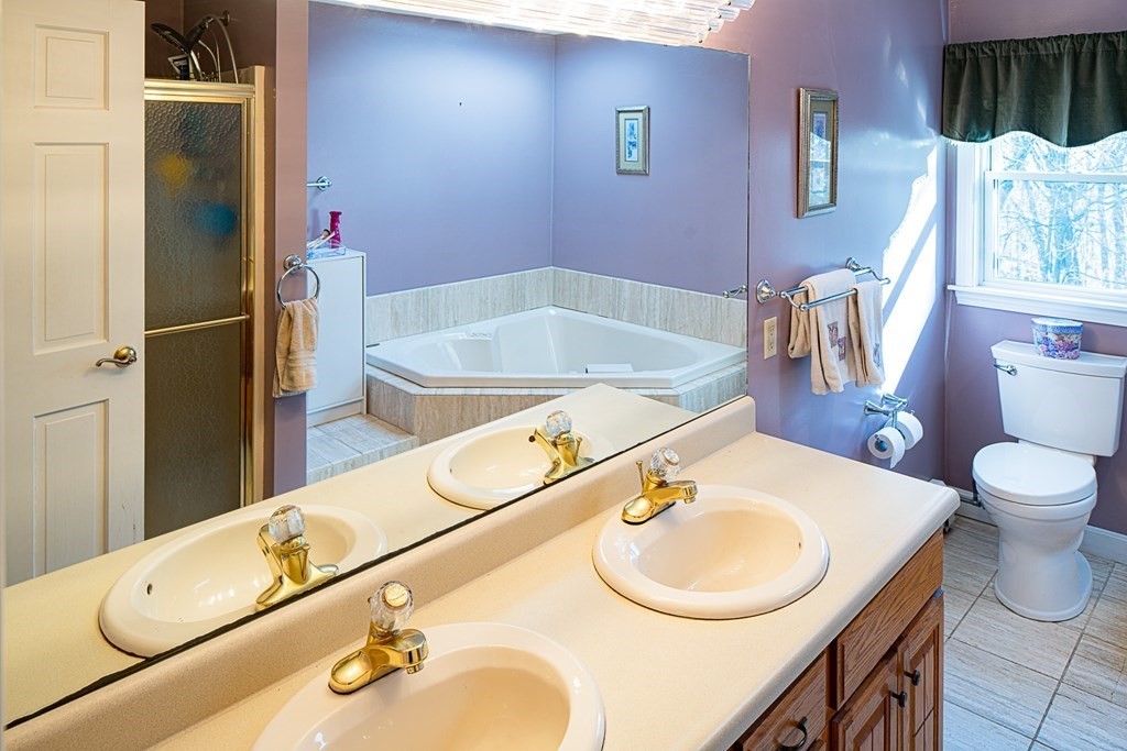 66 Mountwood Road Swampscott, MA 01907 - Photo 17 of 29 a bathroom with a sink and a mirror