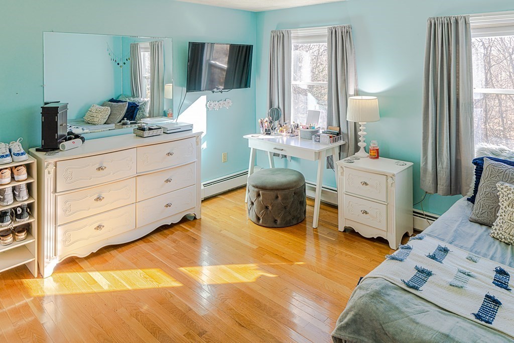 66 Mountwood Road Swampscott, MA 01907 - Photo 18 of 29 a spacious bedroom with a bed and a dresser