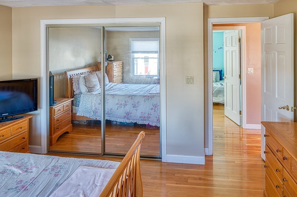 66 Mountwood Road Swampscott, MA 01907 - Photo 19 of 29 a bedroom with furniture and a mirror