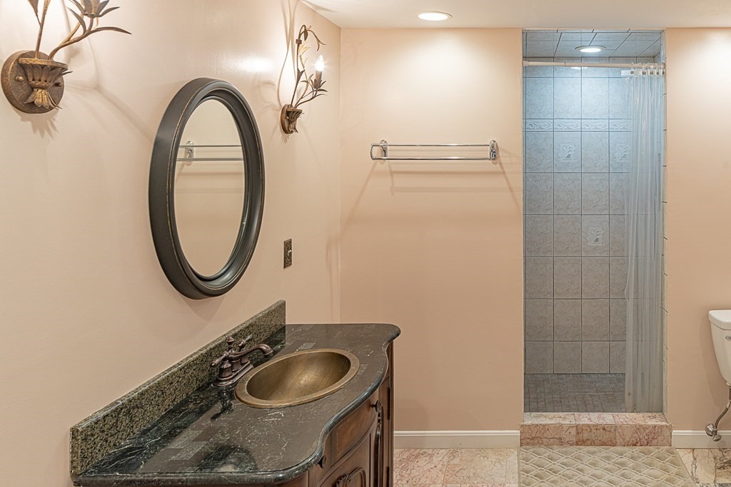 66 Mountwood Road Swampscott, MA 01907 - Photo 21 of 29 a bathroom with a sink and a mirror