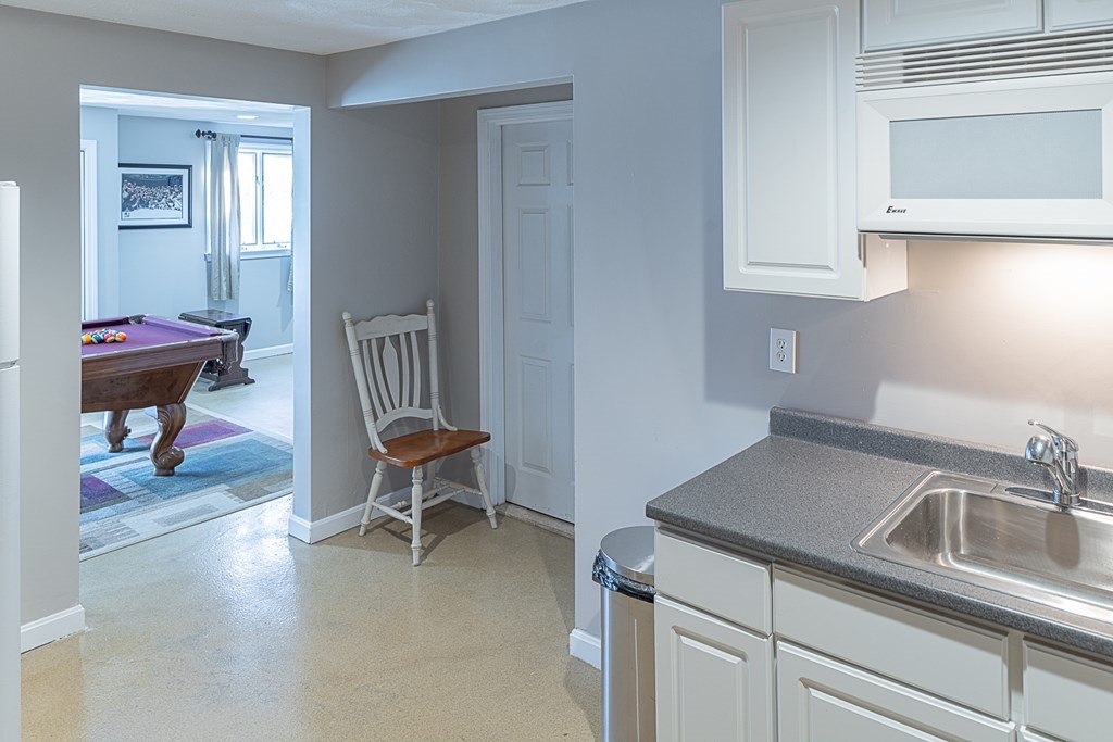 66 Mountwood Road Swampscott, MA 01907 - Photo 22 of 29 a living room with furniture and a chair
