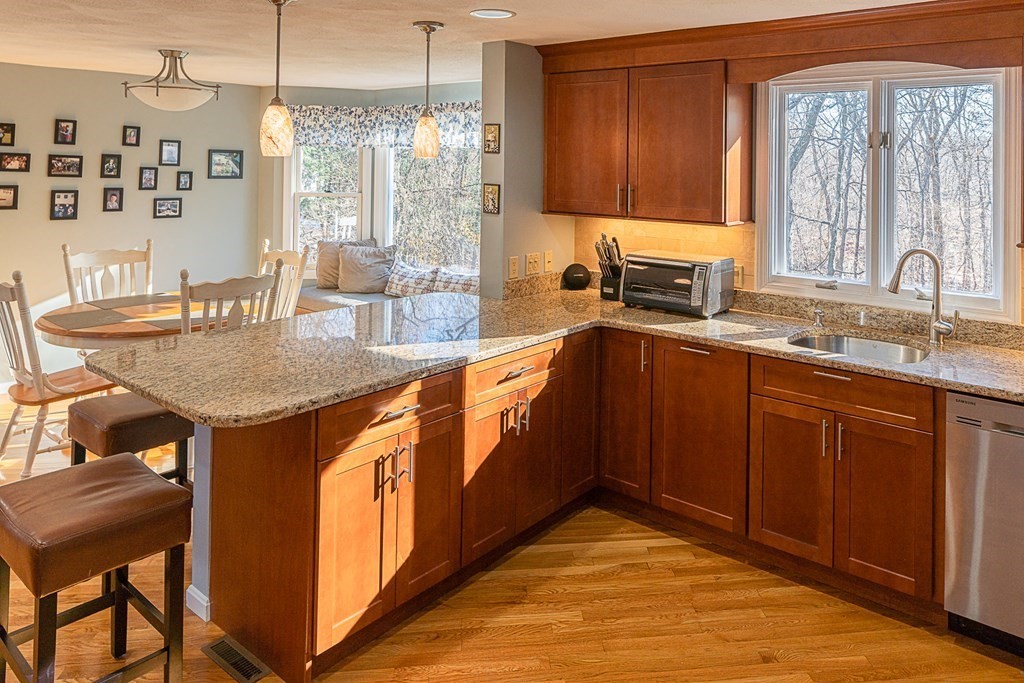 66 Mountwood Road Swampscott, MA 01907 - Photo 6 of 29 a kitchen with stainless steel appliances granite countertop a sink stove and cabinets