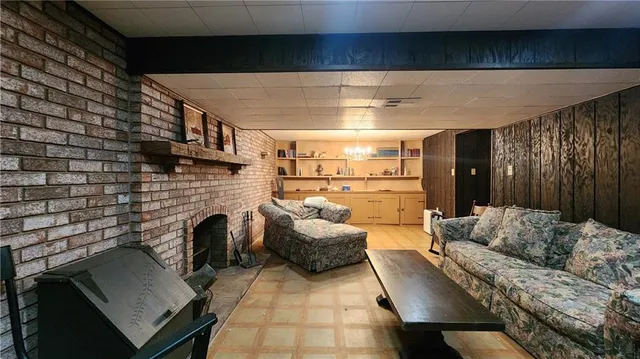 a bedroom with furniture and a fireplace