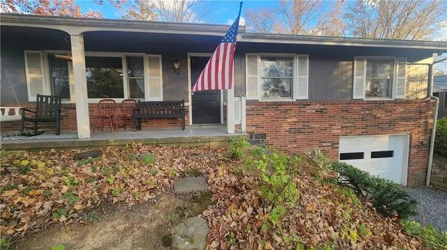 front view of a house with a small yard