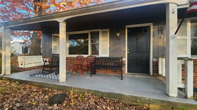 a view of a outdoor space with porch and furniture