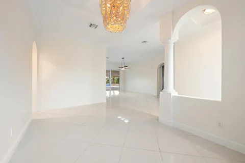 a view of a hallway with seating area