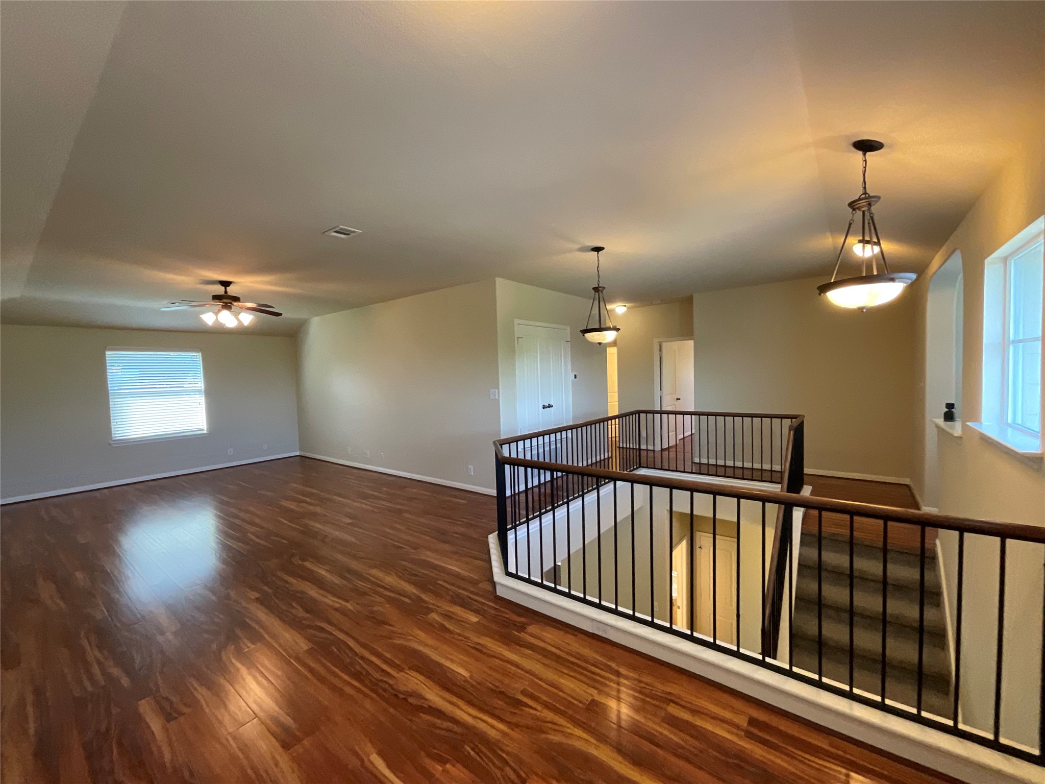 1911 Conn Creek Road Cedar Park, TX 78613 - Photo 24 of 39 a view of staircase with lots of frames on wall and wooden floor