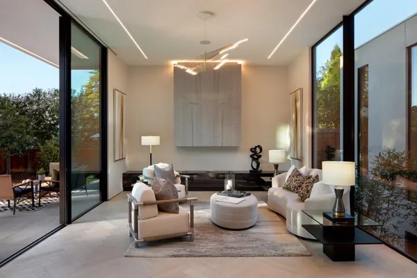 a living room with furniture and a potted plant