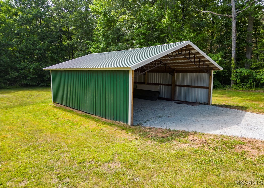 87 Proffits Road Louisa, VA 23093 - Photo 24 of 33 a view of an house with backyard space and garden