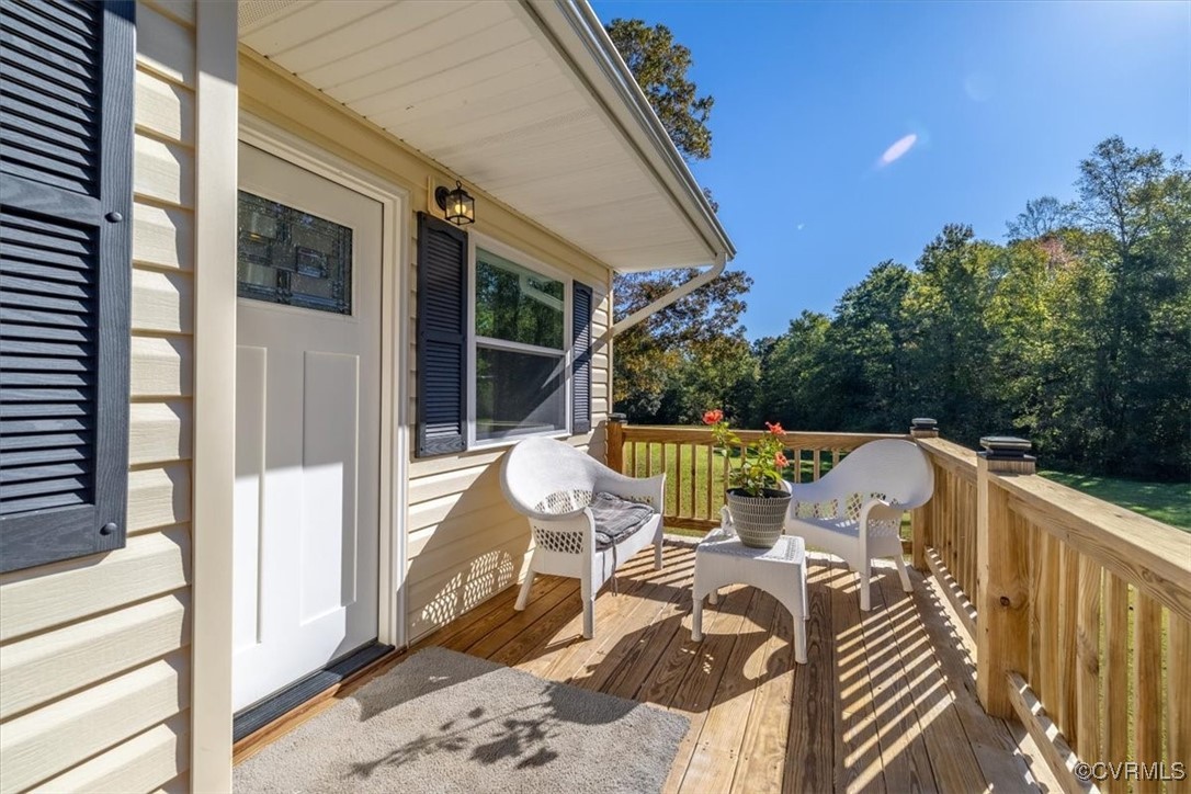 87 Proffits Road Louisa, VA 23093 - Photo 7 of 33 a view of balcony with furniture and garden
