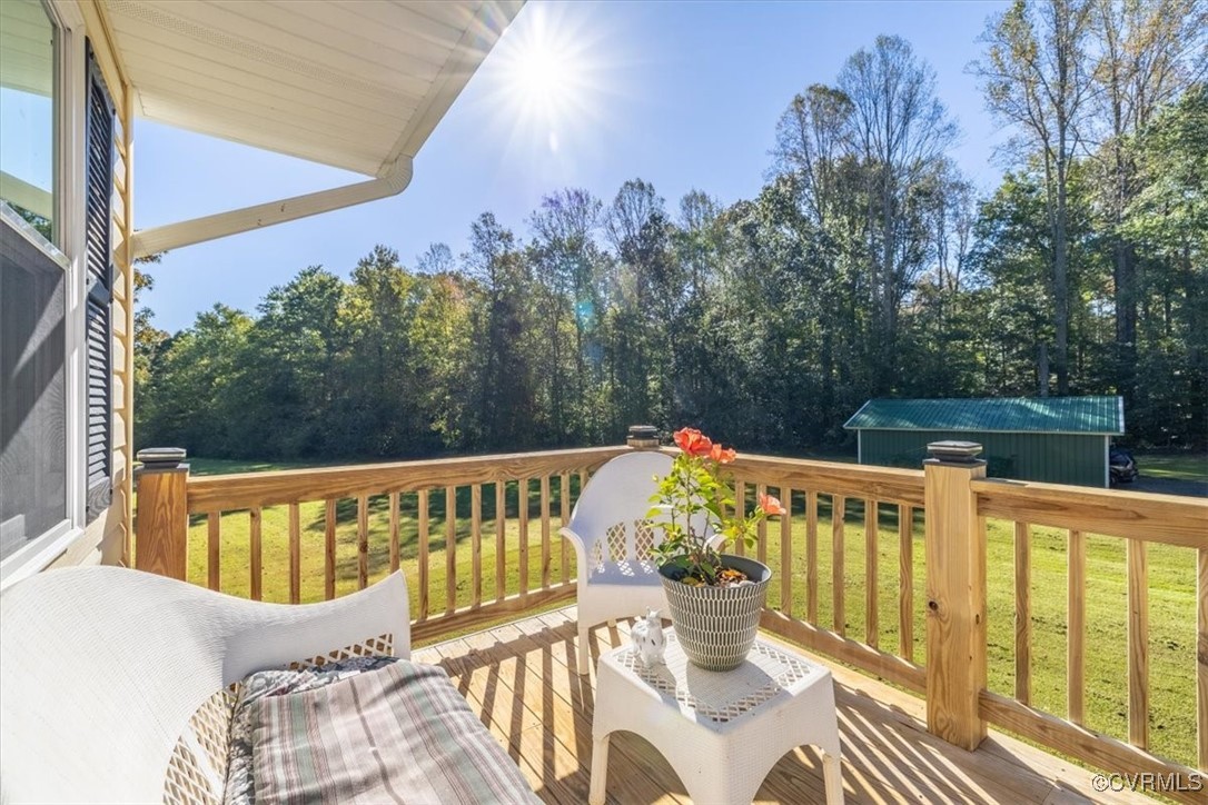87 Proffits Road Louisa, VA 23093 - Photo 8 of 33 a view of a chairs and table on the deck