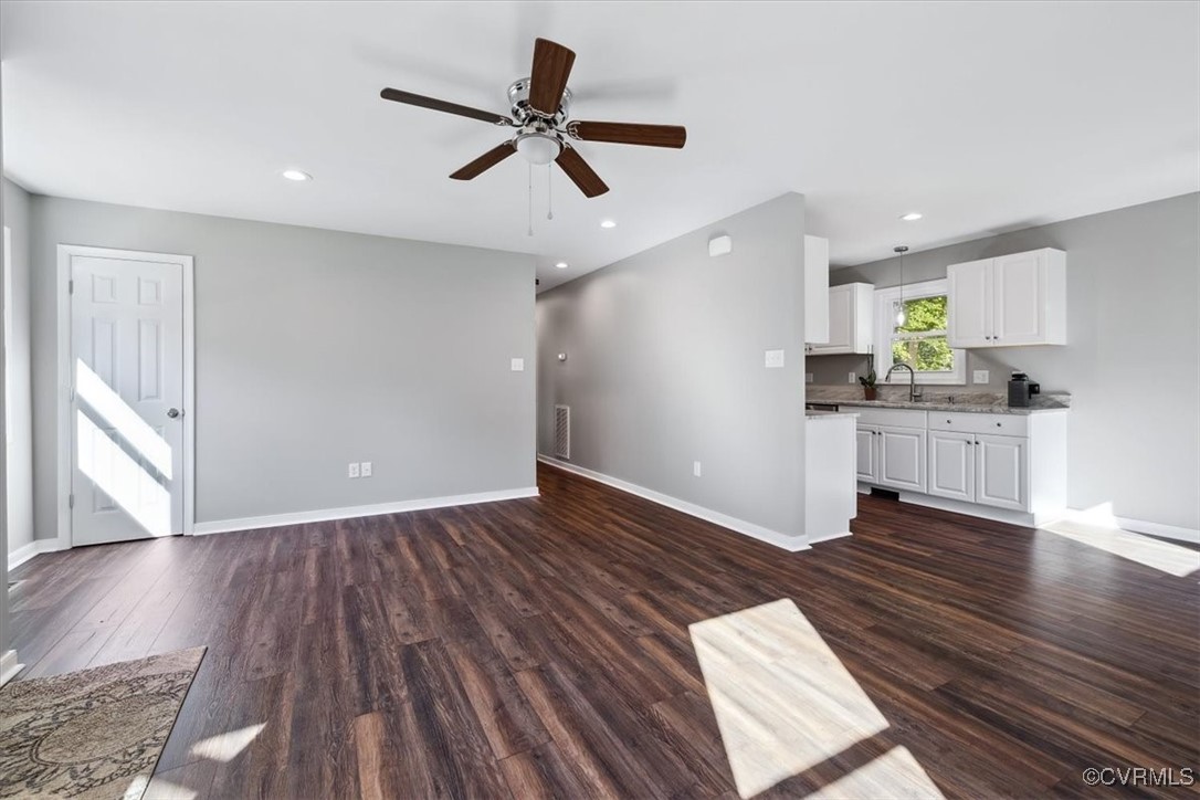 87 Proffits Road Louisa, VA 23093 - Photo 10 of 33 a kitchen with wooden floors and white walls