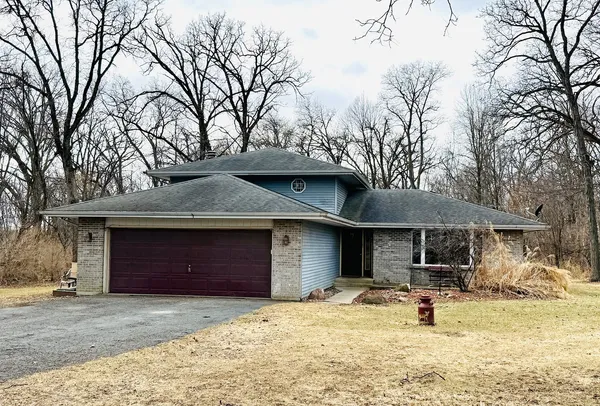 a view of a house with a yard covered with snow in front of house