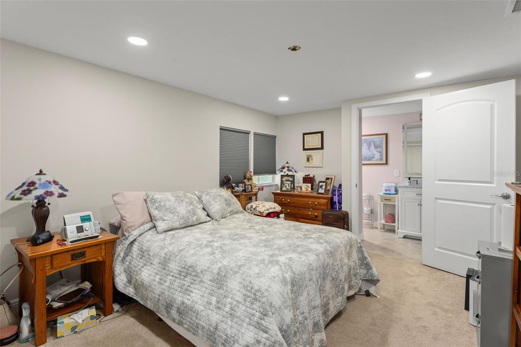 16838 Old Highway 50 East Clermont, FL 34711 - Photo 12 of 51 a bedroom with a bed and a table