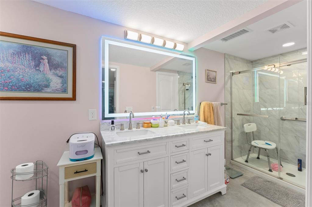 16838 Old Highway 50 East Clermont, FL 34711 - Photo 14 of 51 a bathroom with a sink mirror vanity and toilet