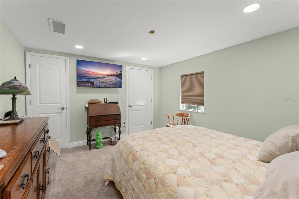 16838 Old Highway 50 East Clermont, FL 34711 - Photo 15 of 51 a bedroom with a bed and a flat screen tv