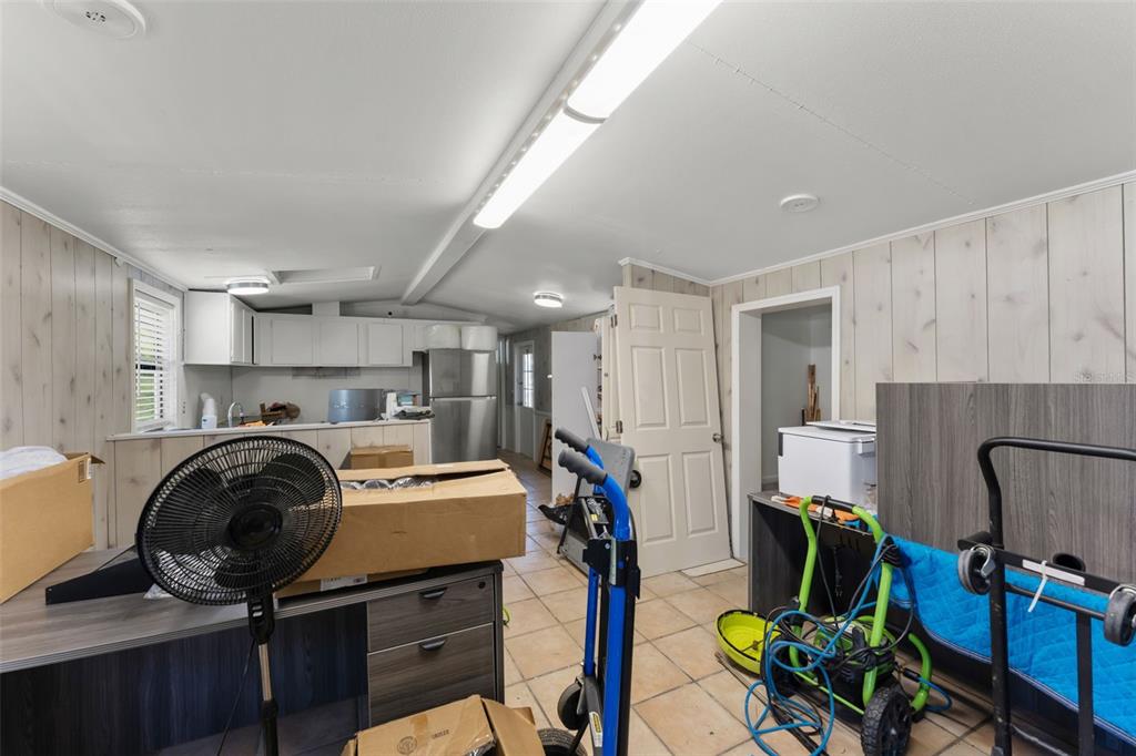 16838 Old Highway 50 East Clermont, FL 34711 - Photo 22 of 51 a view of a kitchen with fridge and workspace
