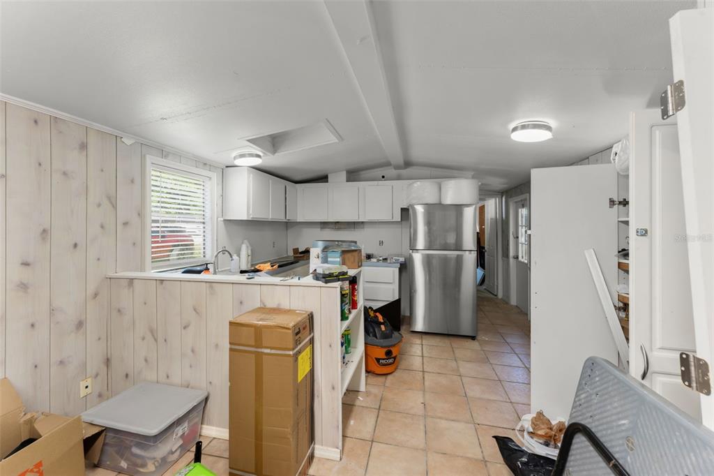 16838 Old Highway 50 East Clermont, FL 34711 - Photo 23 of 51 a kitchen with refrigerator cabinets and a sink