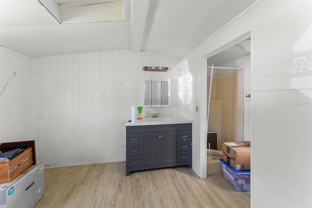 16838 Old Highway 50 East Clermont, FL 34711 - Photo 25 of 51 a room with a mirror and a sink
