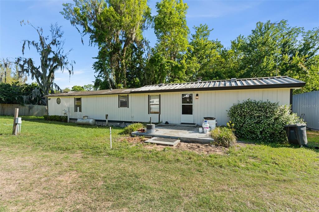 16838 Old Highway 50 East Clermont, FL 34711 - Photo 27 of 51 a view of a house with backyard and a tree